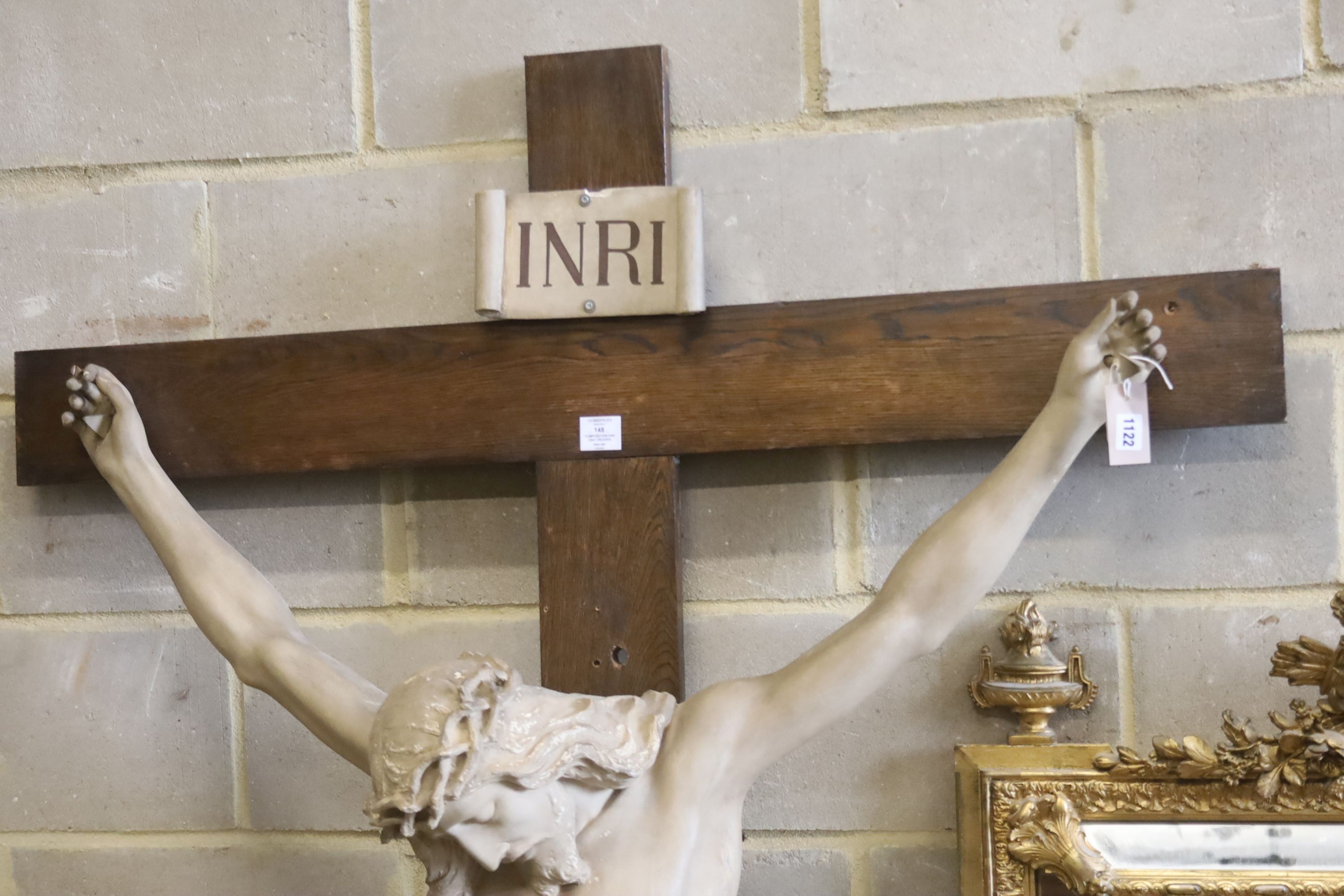 A large composition and oak crucifix, width 126cm, height 218cm